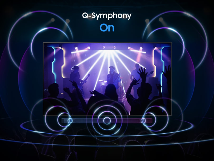 TV Samsung phát cảnh một ban nhạc biểu diễn với trọng tâm là tay trống. TV phát ra các vòng âm thanh ở nhiều kích cỡ khác nhau, phát ra các xung mạnh mẽ và truyền theo mọi hướng để lấp đầy không gian, cho biết bạn đang sử dụng tính năng Dolby Atmos.